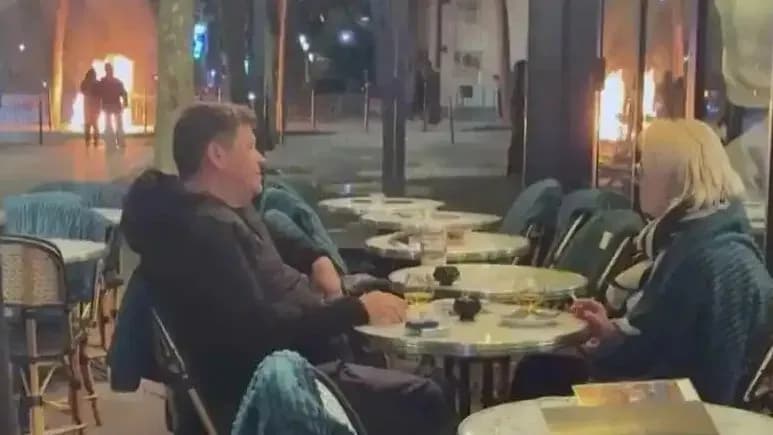 巴黎骚乱起底：凯旋门边喝酒的情侣，和街头的美国队长